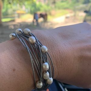 Lustrous pearl beads accented leather band bracelet